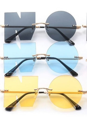 Rimless NO Letter Sunglasses In different colors, light blue, yellow, red, pink, gray, and black