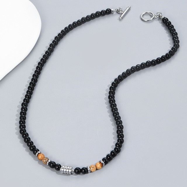 A stainless steel necklace of beads combined with the eye of the tiger