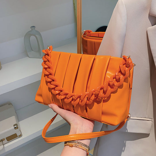 Crossbody Shoulder Bag Chain handle and designer pleats in orange