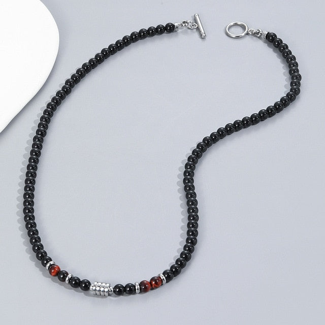 A stainless steel necklace of beads combined with the eye of the tiger